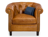 Sillón chesterfield de piel cognac reposabrazos con tachuelas