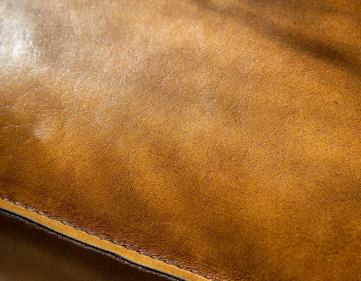 Chesterfield leather armchair cognac studded armrests