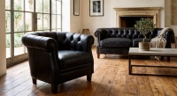 Canapé Chesterfield cuir 2 places noir accoudoirs cloutés