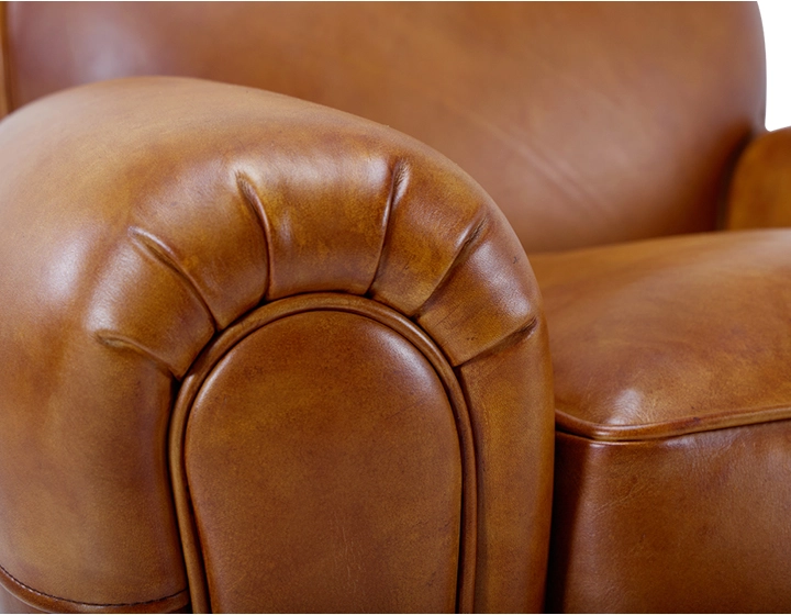 Fauteuil club cuir cognac accoudoirs passepoil