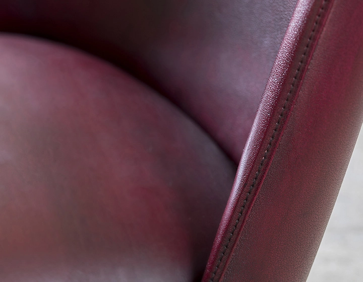 Vintage armchair with leather armrests burgundy