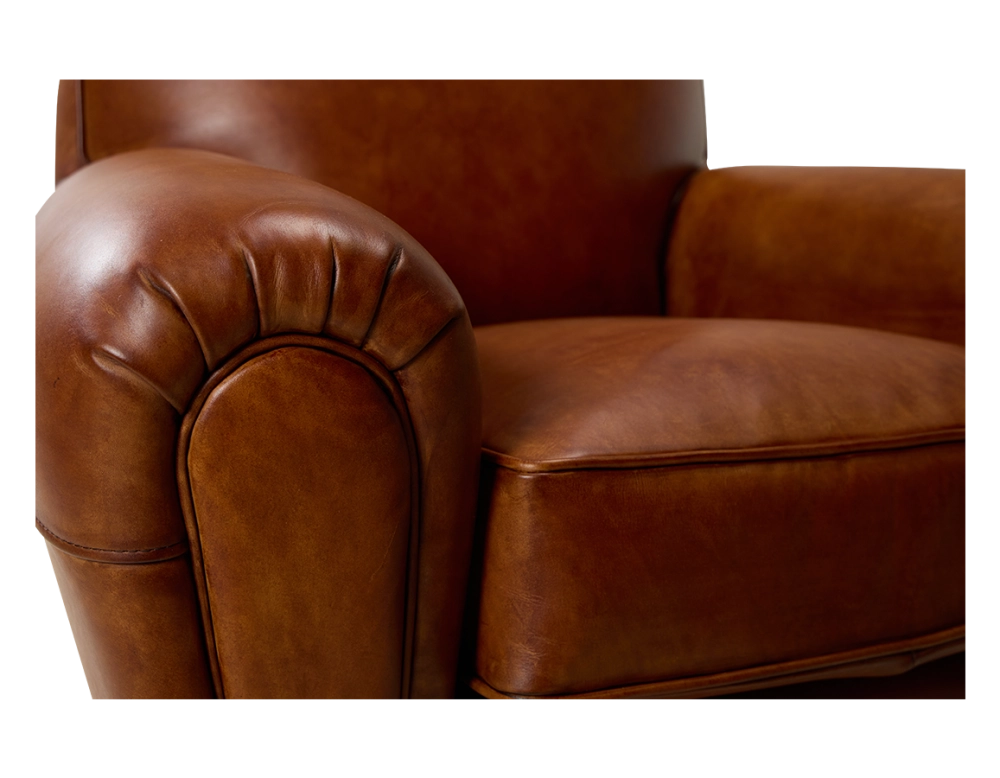 Fauteuil club cuir marron clair accoudoirs passepoil