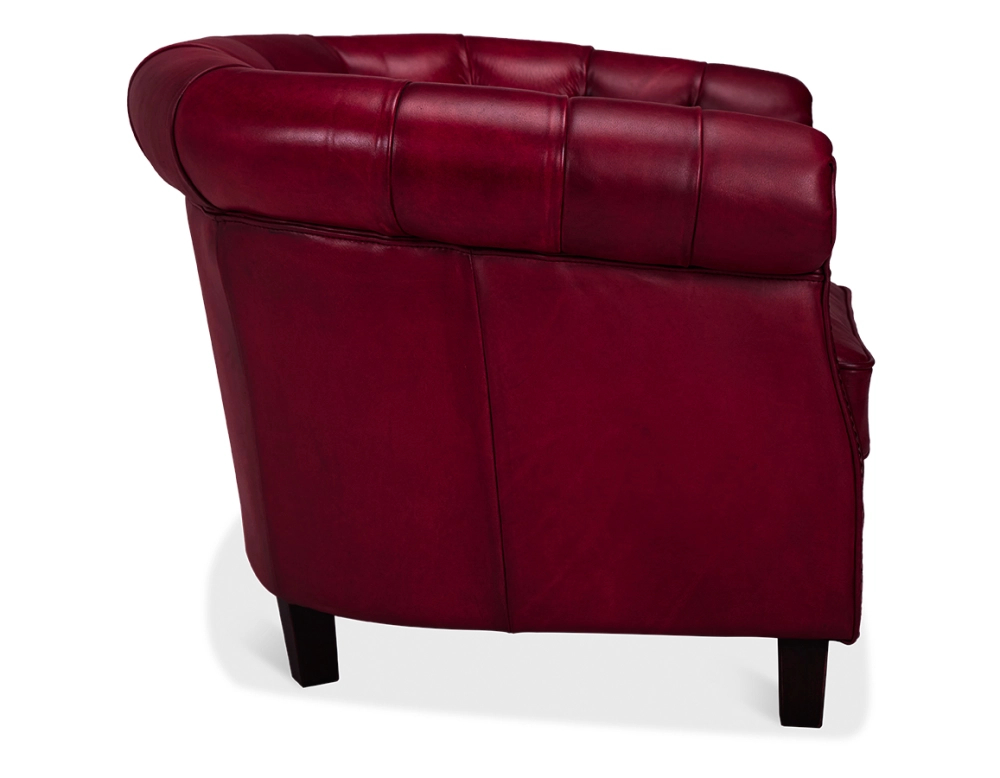Sillón Chesterfield de piel rojo carmín reposabrazos con tachuelas