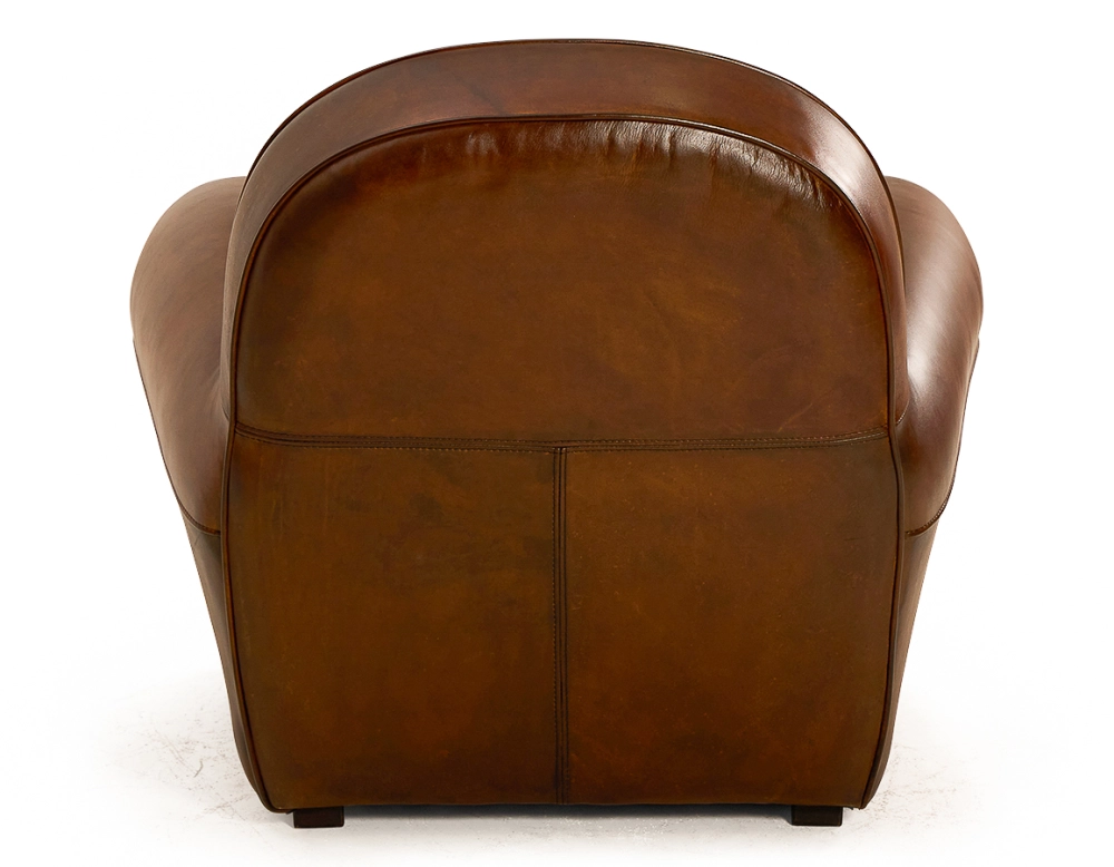 Fauteuil club cuir marron vintage accoudoirs cloutés