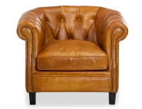Sillón chesterfield de piel cognac reposabrazos con tachuelas
