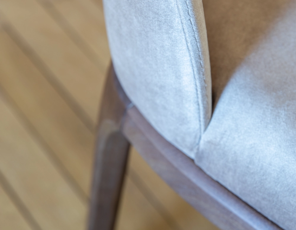 Designer chair dark brown stained wood and light taupe velvet fabric