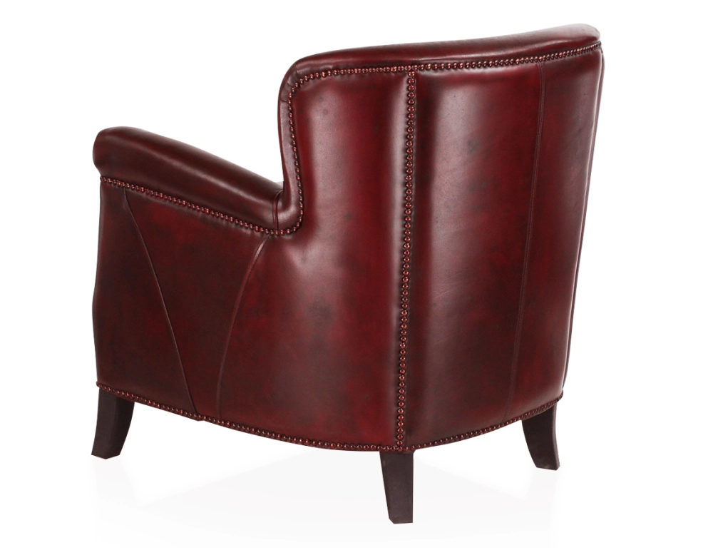 Fauteuil club cuir rouge carmin accoudoirs cloutés