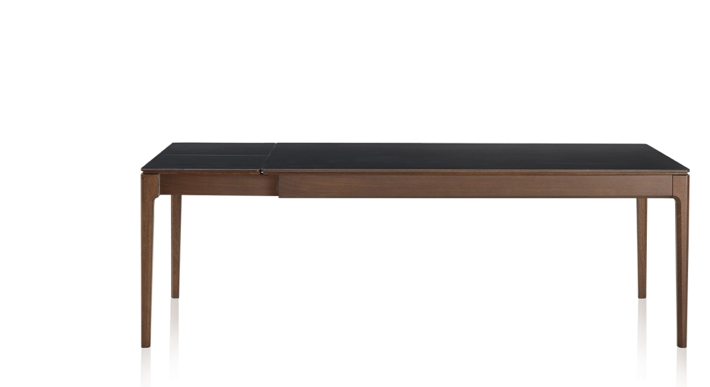 Extendable oak and ceramic table for 6 to 10 people with ceramic extensions with dark brown stained wood and plain black ceramic top and extensions 140x90 cm