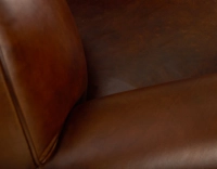 Fauteuil club cuir marron vintage accoudoirs cloutés