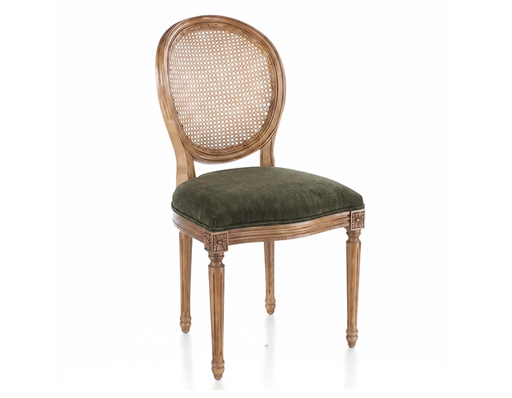 Louis XVI style antique chair wooden chair with antique finish, cane backrest, and olive green velvet seat.