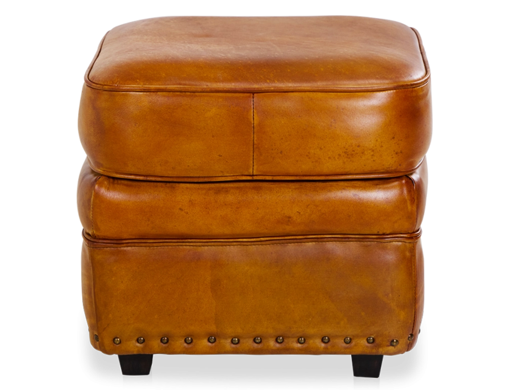 Puf de piel cognac borde tachonado