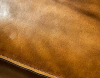 Chesterfield leather armchair cognac studded armrests