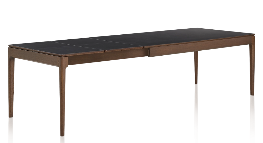 Extendable oak and ceramic table for 6 to 10 people with ceramic extensions with dark brown stained wood and plain black ceramic top and extensions 140x90 cm